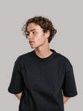 Man wearing black oversized drop shoulder t-shirt