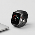 Black smart watch with silicone strap showing activity rings