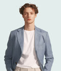 Man wearing sky blue textured casual blazer with white t-shirt