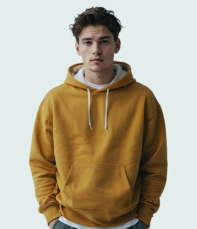 Man wearing mustard yellow pullover hoodie