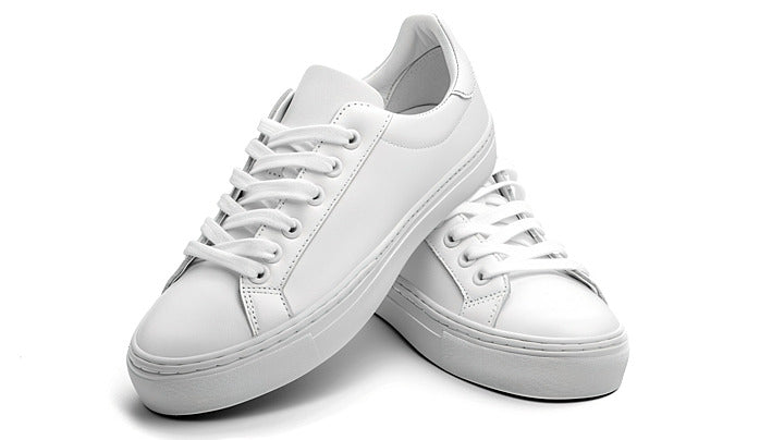 Pair of white lace-up casual sneakers