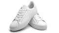 Pair of white lace-up casual sneakers